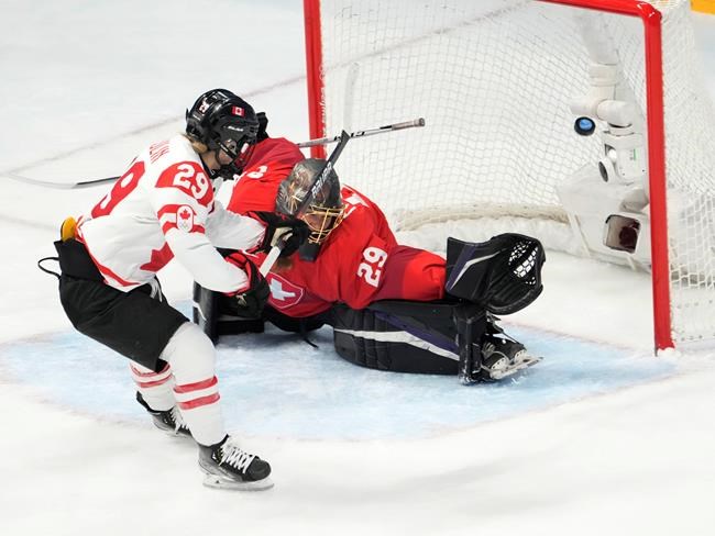 Canada forward Marie-Philip Poulin (29) scores on Switzerland goaltender Saskia Maurer during second period women's ice hockey semifinals action Monday, February 14, 2022 at the 2022 Winter Olympics in Beijing. THE CANADIAN PRESS/Ryan Remiorz