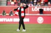 Brentford's Christian Eriksen gestures as he walks in the field ahead of the English Premier League soccer match between Brentford and Crystal Palace at Brentford Community stadium in London, Saturday, Feb. 12, 2022. (AP Photo/David Cliff)