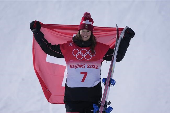 Gold medal winner Switzerland's Mathilde Gremaud celebrate during the venue award ceremony for the women's slopestyle finals at the 2022 Winter Olympics, Tuesday, Feb. 15, 2022, in Zhangjiakou, China. (AP Photo/Lee Jin-man)