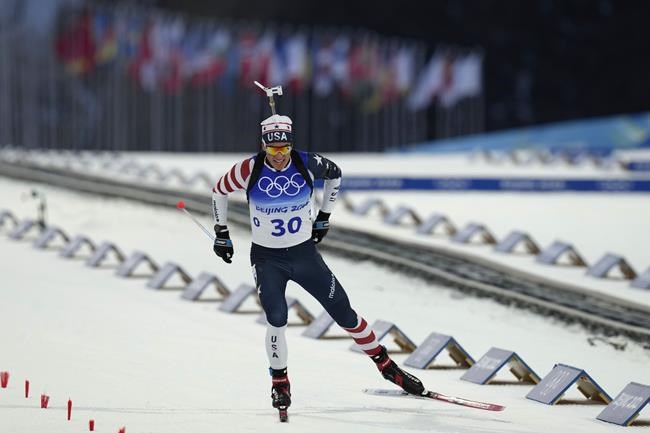FILE - Paul Schommer crosses the finish line during the men's 20-kilometer individual race at the 2022 Winter Olympics, Tuesday, Feb. 8, 2022, in Zhangjiakou, China. (AP Photo/Kirsty Wigglesworth, File)