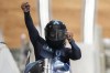 Elana Meyers Taylor, of the United States, celebrates after the finish during the women's monobob heat 4 at the 2022 Winter Olympics, Monday, Feb. 14, 2022, in the Yanqing district of Beijing. (AP Photo/Pavel Golovkin)