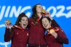 Valerie Maltais (right) Ivanie Blondin (left) and Isabelle Weidemann of Canada celebrate with their gold medals during a medal ceremony for the speedskating women's team pursuit at the 2022 Winter Olympics, Tuesday, Feb. 15, 2022, in Beijing. THE CANADIAN PRESS/AP/Jae C. Hong