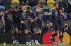 Manchester City players celebrate the second goal of their team during the Champions League round of 16 soccer match between Sporting CP and Manchester City at the Alvalade stadium in Lisbon, Portugal, Tuesday, Feb. 15, 2022. (AP Photo/Armando Franca)