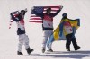 From left silver medal winner United State's Nick Goepper, gold medal winner United States' Alexander Hall and bronze medal winner Sweden's Jesper Tjader celebrate afrter the men's slopestyle finals at the 2022 Winter Olympics, Wednesday, Feb. 16, 2022, in Zhangjiakou, China. (AP Photo/Francisco Seco)