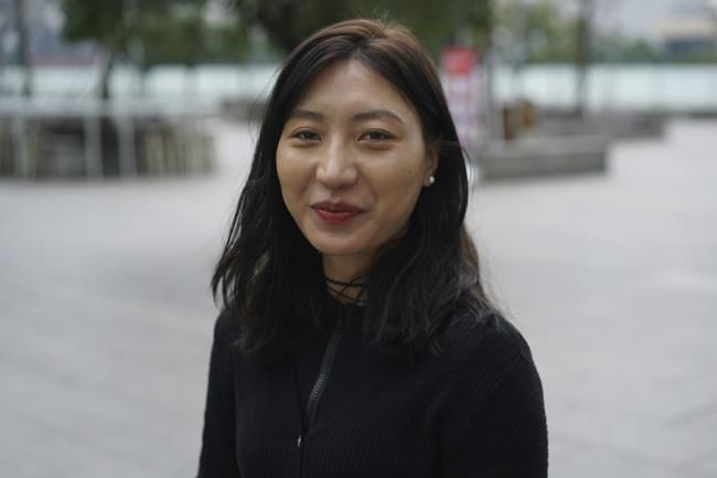 Kunchok Dolma, a Tibetan dance teacher who is also proud be a Chinese, poses for a photo in Chengdu in southwestern China's Sichuan province on Tuesday, Feb. 8, 2022.