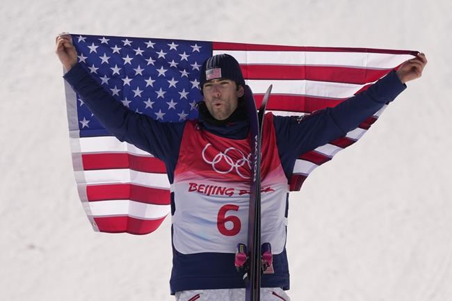 Gold medal winner United States' Alexander Hall celebrates during the venue award ceremony for the men's slopestyle at the 2022 Winter Olympics, Wednesday, Feb. 16, 2022, in Zhangjiakou, China. (AP Photo/Francisco Seco)