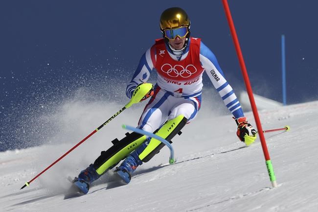 Clement Noel, of France passes a gate during the second run of the men's slalom at the 2022 Winter Olympics, Wednesday, Feb. 16, 2022, in the Yanqing district of Beijing. (AP Photo/Alessandro Trovati)