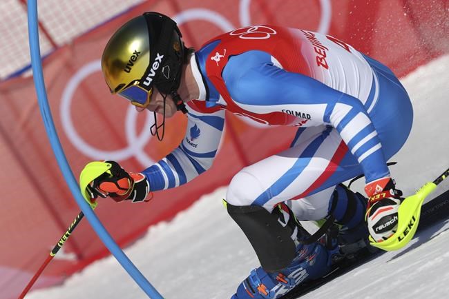 Clement Noel, of France passes a gate during the second run of the men's slalom at the 2022 Winter Olympics, Wednesday, Feb. 16, 2022, in the Yanqing district of Beijing. (AP Photo/Alessandro Trovati)