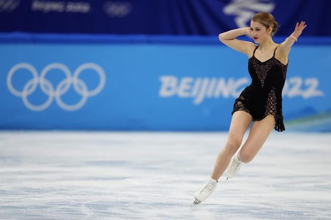 Alexia Paganini, of Switzerland, competes in the women's short program during the figure skating at the 2022 Winter Olympics, Tuesday, Feb. 15, 2022, in Beijing. (AP Photo/Natacha Pisarenko)