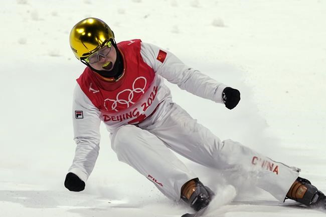 China's Qi Guangpu reacts during the men's aerials finals at the 2022 Winter Olympics, Wednesday, Feb. 16, 2022, in Zhangjiakou, China. (AP Photo/Francisco Seco)