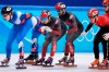 Charles Hamelin (6) of Canada pushes teammate Jordan Pierre-Gilles (67) on their way to a gold medal in the men's 5,000-metre short-track speedskating relay final at the Beijing Winter Olympics in Beijing, China, on Wednesday, Feb. 16, 2022. THE CANADIAN PRESS/Paul Chiasson