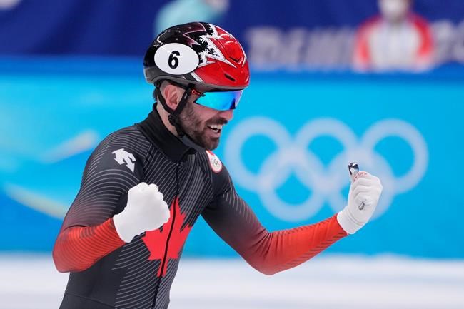 Charles Hamelin (6) of Canada after winning gold in the men's 5,000-metre short-track speedskating relay final at the Beijing Winter Olympics in Beijing, China, on Wednesday, Feb. 16, 2022. THE CANADIAN PRESS/Paul Chiasson