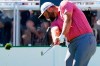 Jon Rahm, of Spain, hits his tee shot at the 16th hole during the final round of the Phoenix Open golf tournament Sunday, Feb. 13, 2022, in Scottsdale, Ariz. (AP Photo/Ross D. Franklin)