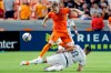 Houston Dynamo Canadian forward Tyler Pasher (19) goes over Real Salt Lake midfielder Damir Kreilach (8), during the second half of an MLS match on July 31, 2021, in Houston. A goal by Pasher, a former Toronto FC academy member, proved to be the difference Wednesday as Toronto lost 2-1 to the Houston Dynamo in MLS pre-season play. THE CANADIAN PRESS/AP-Michael Wyke
