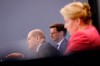 German Chancellor Olaf Scholz, left, sits between North Rhine-Westphalia's Prime Minister Hendrik Wuest, center, and Berlin's Mayor Franziska Giffey, right, during a news conference following a meeting with the federal state governors on measures to battle the coronavirus pandemic at the chancellery in Berlin, Germany, Wednesday, Feb. 16, 2022. (Michele Tantussi/Pool via AP)