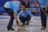 United States' John Shuster watches his throw during a men's curling match against Switzerland at the Beijing Winter Olympics Tuesday, Feb. 15, 2022, in Beijing. (AP Photo/Brynn Anderson)