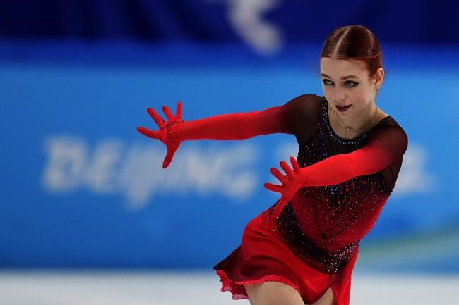 Alexandra Trusova, of the Russian Olympic Committee, competes in the women's short program during the figure skating at the 2022 Winter Olympics, Tuesday, Feb. 15, 2022, in Beijing. (AP Photo/Natacha Pisarenko)