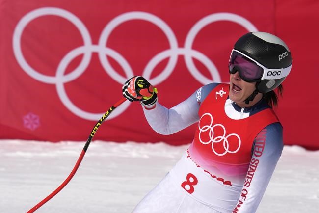 Keely Cashman of the United States reacts after finishing the women's combined downhill at the 2022 Winter Olympics, Thursday, Feb. 17, 2022, in the Yanqing district of Beijing. (AP Photo/Luca Bruno)