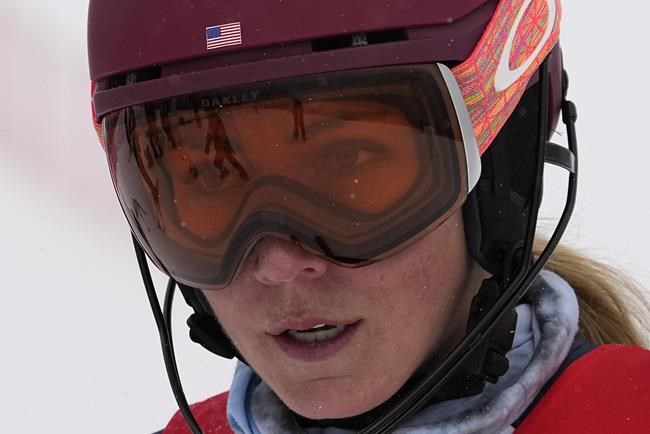 Mikaela Shiffrin of the United States stands on the side of the course after crashing out during the women's combined slalom at the 2022 Winter Olympics, Thursday, Feb. 17, 2022, in the Yanqing district of Beijing. (AP Photo/Robert F. Bukaty)