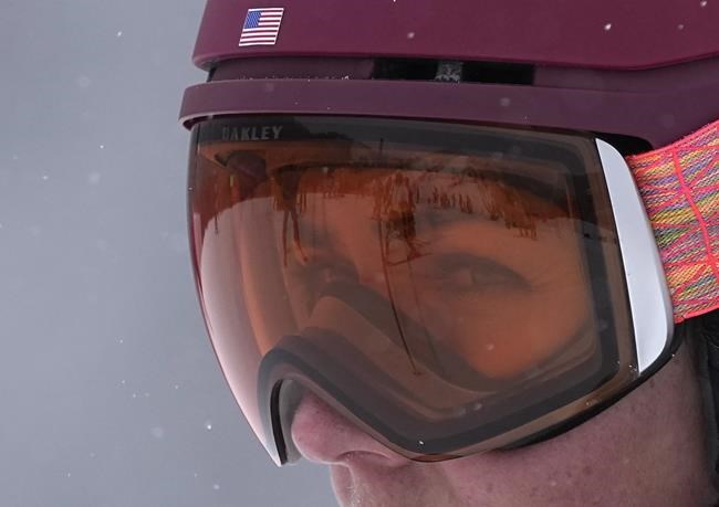 Mikaela Shiffrin of the United States inspects the course before the women's combined slalom at the 2022 Winter Olympics, Thursday, Feb. 17, 2022, in the Yanqing district of Beijing. (AP Photo/Robert F. Bukaty)