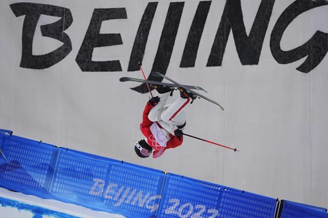 China's He Binghan competes during the men's halfpipe qualification at the 2022 Winter Olympics, Thursday, Feb. 17, 2022, in Zhangjiakou, China. (AP Photo/Lee Jin-man)