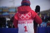 China's Eileen Gu talks to reporters after the women's halfpipe qualification at the 2022 Winter Olympics, Thursday, Feb. 17, 2022, in Zhangjiakou, China. (AP Photo/Francisco Seco)