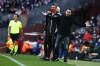 Barcelona's head coach Xavi Hernandez gestures at referee Jesus Gil Manzano during a Spanish La Liga soccer match between FC Barcelona and Atletico Madrid at the Camp Nou stadium in Barcelona, Spain, Sunday, Feb. 6, 2022. (AP Photo/Joan Monfort)