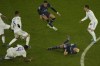 PSG's Neymar, bottom right, is fouled by Real Madrid's David Alaba during the Champions League, round of 16, first leg soccer match between Paris Saint Germain and Real Madrid at the Parc des Princes stadium, in Paris, France, Tuesday, Feb. 15, 2022. (AP Photo/Francois Mori)