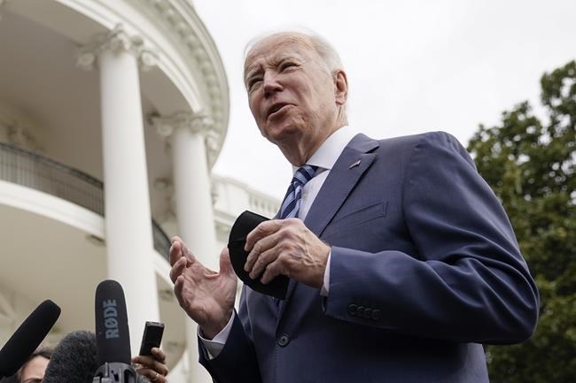 President Joe Biden speaks with members of the press before boarding Marine One on the South Lawn of the White House, Thursday, Feb. 17, 2022, in Washington. Biden is en route to Ohio to promote his infrastructure agenda. (AP Photo/Patrick Semansky)