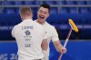 Britain's Hammy McMillan celebrates with Bobby Lammie after winning the men's curling semifinal match against the United States at the Beijing Winter Olympics Thursday, Feb. 17, 2022, in Beijing. (AP Photo/Brynn Anderson)