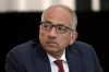 FILE - Then-U.S. Soccer President Carlos Cordeiro presides over a meeting of the U.S. Soccer Board of Directors in Chicago, Dec. 6, 2019. Corderio is trying to oust Cindy Parlow Cone, who took over as U.S. Soccer Federation president in March 2020 when Cordeiro quit in the fallout from federation legal filings that claimed women’s national team players had less physical ability and responsibility than male counterparts. The USSF national council meets on March 5 to vote a four-year term.(AP Photo/Charles Rex Arbogast, File)