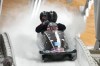 Hunter Church of the United States and his team finish during a 4-man bobsleigh training heat at the 2022 Winter Olympics, Thursday, Feb. 17, 2022, in the Yanqing district of Beijing. (AP Photo/Dmitri Lovetsky)