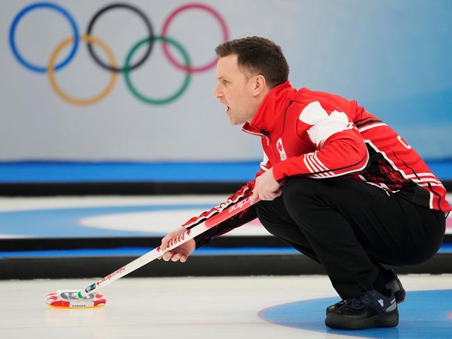 Canada skip Brad Gushue calls to his sweepers during men's bronze medal curling action against the United States at the 2022 Winter Olympics in Beijing on Friday, Feb. 18, 2022. THE CANADIAN PRESS/Ryan Remiorz