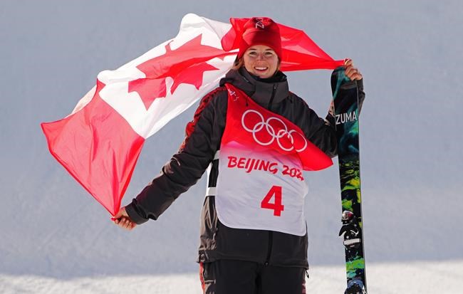 Canada's Cassie Sharpe celebrates her silver medal in the freestyle women's ski halfpipe final during the Beijing Winter Olympic Games, in Zhangjiakou, China, Friday, Feb. 18, 2022. THE CANADIAN PRESS/Sean Kilpatrick
