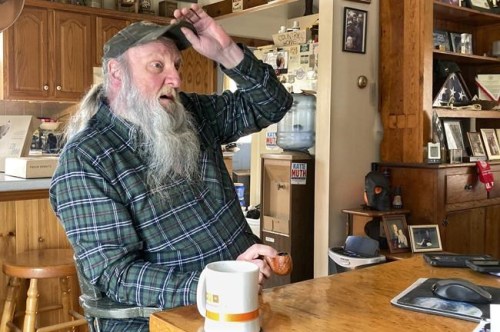 Ray Kemble talks about his water issues in his home in Dimock, Pa., Feb. 14, 2022. Kemble recently met with officials in the Pennsylvania attorney general's office regarding the criminal case against a gas driller charged with polluting Dimock's groundwater with methane. Faulty gas wells drilled by Cabot Oil & Gas were blamed for leaking methane into the groundwater in Dimock, in one of the best-known pollution cases ever to emerge from the U.S. drilling and fracking boom. (AP Photo/Mike Rubinkam)