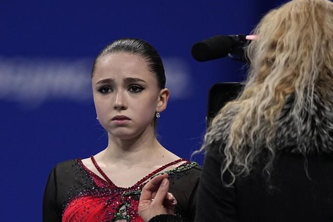 Kamila Valieva, of the Russian Olympic Committee, reacts after competing in the women's free skate program during the figure skating competition at the 2022 Winter Olympics, Thursday, Feb. 17, 2022, in Beijing. (AP Photo/David J. Phillip)