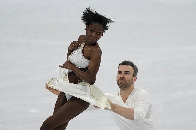 Vanessa James and Eric Radford, of Canada, compete in the pairs short program during the figure skating competition at the 2022 Winter Olympics, Friday, Feb. 18, 2022, in Beijing. THE CANADIAN PRESS/AP/David J. Phillip