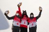 Gold medallist of China, Eileen Gu, centre,silver medallist of Canada, Cassie Sharpe and bronze medallist of Canada, Rachael Karker celebrate following the freestyle women's ski halfpipe final during the Beijing Winter Olympic Games, in Zhangjiakou, China, Friday, Feb. 18, 2022. THE CANADIAN PRESS/Sean Kilpatrick