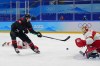 Canada's Adam Tambellini (15) shoots against Canada goalkeeper Devon Levi (1) during a men's qualification round hockey game at the 2022 Winter Olympics, Tuesday, Feb. 15, 2022, in Beijing. (AP Photo/Matt Slocum)