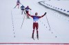 Russian athlete Alexander Bolshunov reacts as he nears the finish line during the men's weather-shortened 50km mass start free cross-country skiing competition at the 2022 Winter Olympics, Saturday, Feb. 19, 2022, in Zhangjiakou, China. (AP Photo/Alessandra Tarantino)