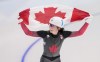 Canada's Ivanie Blondin celebrates her silver medal in the women's mass start speedskating final at the 2022 Winter Olympics in Beijing on Saturday, February 19, 2022. THE CANADIAN PRESS/Paul Chiasson