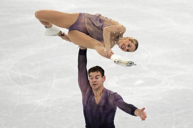 Alexa Knierim and Brandon Frazier, of the United States, compete in the pairs free skate program during the figure skating competition at the 2022 Winter Olympics, Saturday, Feb. 19, 2022, in Beijing. (AP Photo/Bernat Armangue)