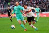Bochum's Maxim Leitsch, left, and Stuttgart's Tiago Barreiros de Melo Tomas challenge for the ball during the Bundesliga soccer match between VfB Stuttgart and VfL Bochum in Stuttgart, Germany, Saturday, Feb. 19, 2022. (Marijan Murat/dpa via AP)