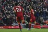 Liverpool's Mohamed Salah, right, celebrates after scoring his sides second goal during the English Premier League soccer match between Liverpool and Norwich City and at Anfield stadium in Liverpool, England, Saturday, Feb. 19, 2022. (AP Photo/Rui Vieira)