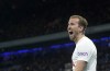 Tottenham's Harry Kane celebrates after scoring his side's third goal during the English Premier League soccer match between Manchester City and Tottenham Hotspur, at the Etihad stadium in Manchester, England, Saturday, Feb. 19, 2022. (AP Photo/Jon Super)