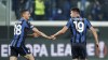 Atalanta's Berat Djimsiti, right, celebrates with his teammate Merih Demiral after scoring his side's second goal during the Europa League, round of 16 soccer match between Atalanta and Olympiacos, at the Gewiss stadium in Bergamo, Italy, Thursday, Feb. 17, 2022. (Spada/LaPresse via AP)