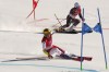 Katharina Liensberger of Austria, front, and Norway's Maria Therese Tviberg race in a semifinal of the mixed team parallel skiing event at the 2022 Winter Olympics, Sunday, Feb. 20, 2022, in the Yanqing district of Beijing. (AP Photo/Luca Bruno)