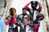 Justin Kripps, Ryan Sommer, Cam Stones and Benjamin Coakwell, of Canada, celebrate winning the bronze medal in the four-man bobsled at the 2022 Winter Olympics, Sunday, Feb. 20, 2022, in the Yanqing district of Beijing. (AP Photo/Mark Schiefelbein)