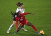 Germany's Jana Feldkamp, left, and Canada's Nichelle Prince battle for the ball during the Arnold Clark Cup women's soccer match between Canada and Germany, at Carrow Road, Norwich, England, Sunday, Feb. 20, 2022. THE CANADIAN PRESS/AP-PA, Joe Giddens