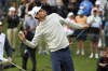 Joaquin Niemann, of Chile, throws his golf ball into the crowd after winning the Genesis Invitational golf tournament at Riviera Country Club, Sunday, Feb. 20, 2022, in the Pacific Palisades area of Los Angeles. (AP Photo/Ryan Kang)
